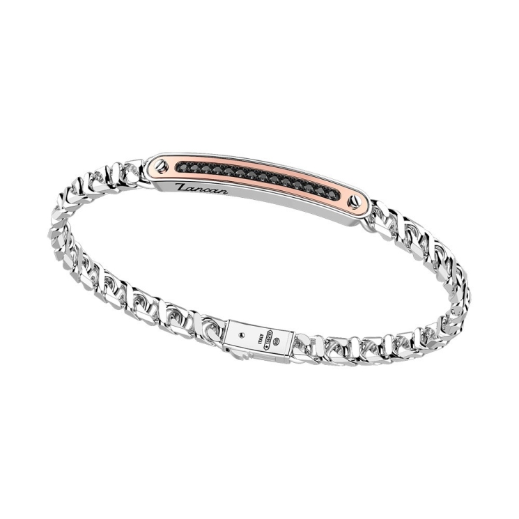 Bracciale in argento con inserto in oro e pietre.