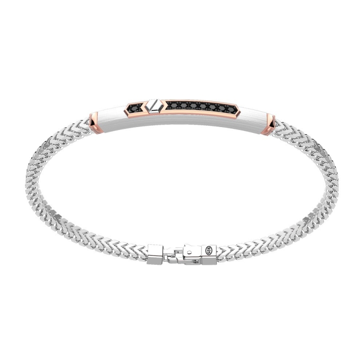 Bracciale in argento con inserto in oro e pietre.