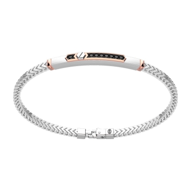 Bracciale in argento con inserto in oro e pietre.
