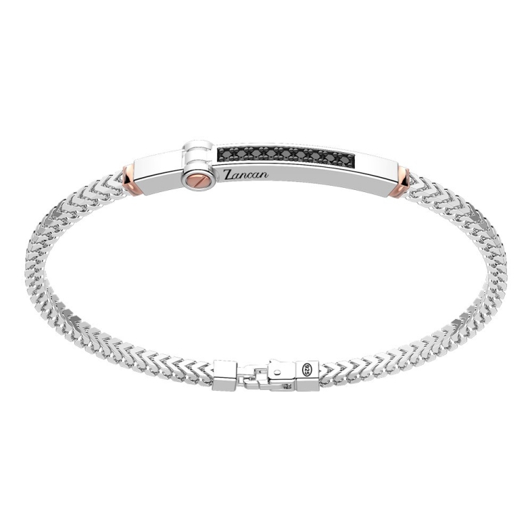 Bracciale in argento con inserto in oro e pietre.