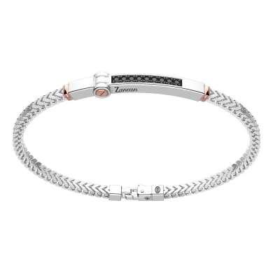 Bracciale in argento con inserto in oro e pietre.