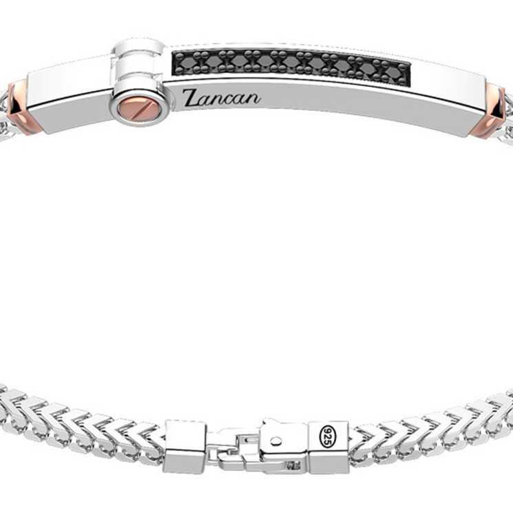 Bracciale in argento con inserto in oro e pietre.