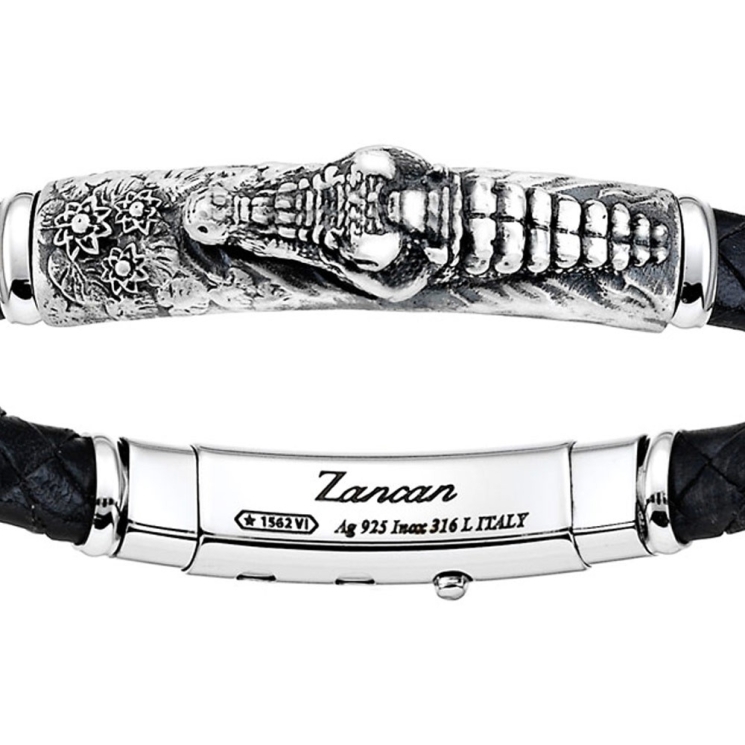 Bracciale con pistola in argento, kevlar nero e smalto nero.