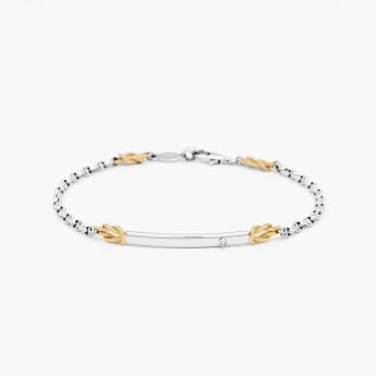 Bracciale in oro bianco, piastra centrale in oro bianco con diamante.