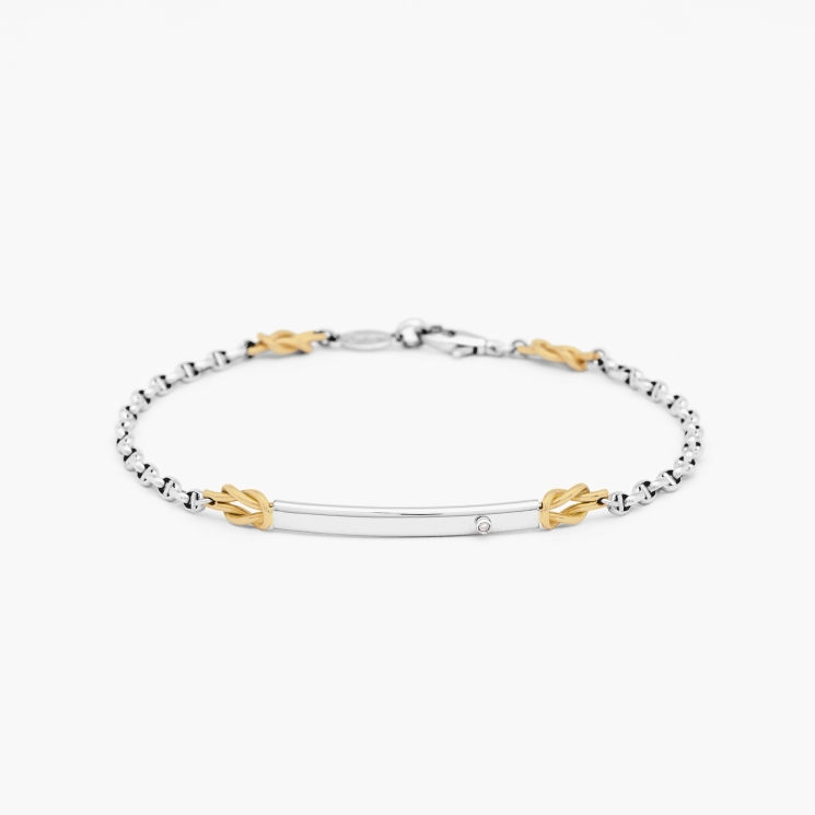 Bracciale in oro bianco, piastra centrale in oro bianco con diamante.