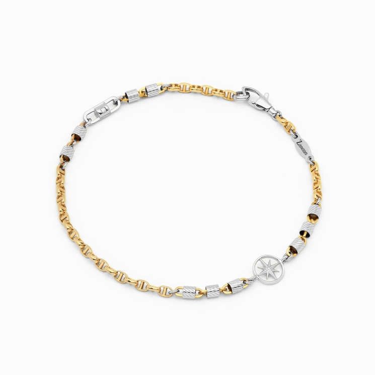 Bracciale in oro giallo e bianco e icona centrale rosa dei venti.