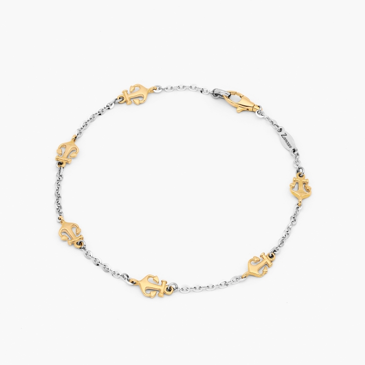 Bracelet in white gold and anchor detail in yellow gold.