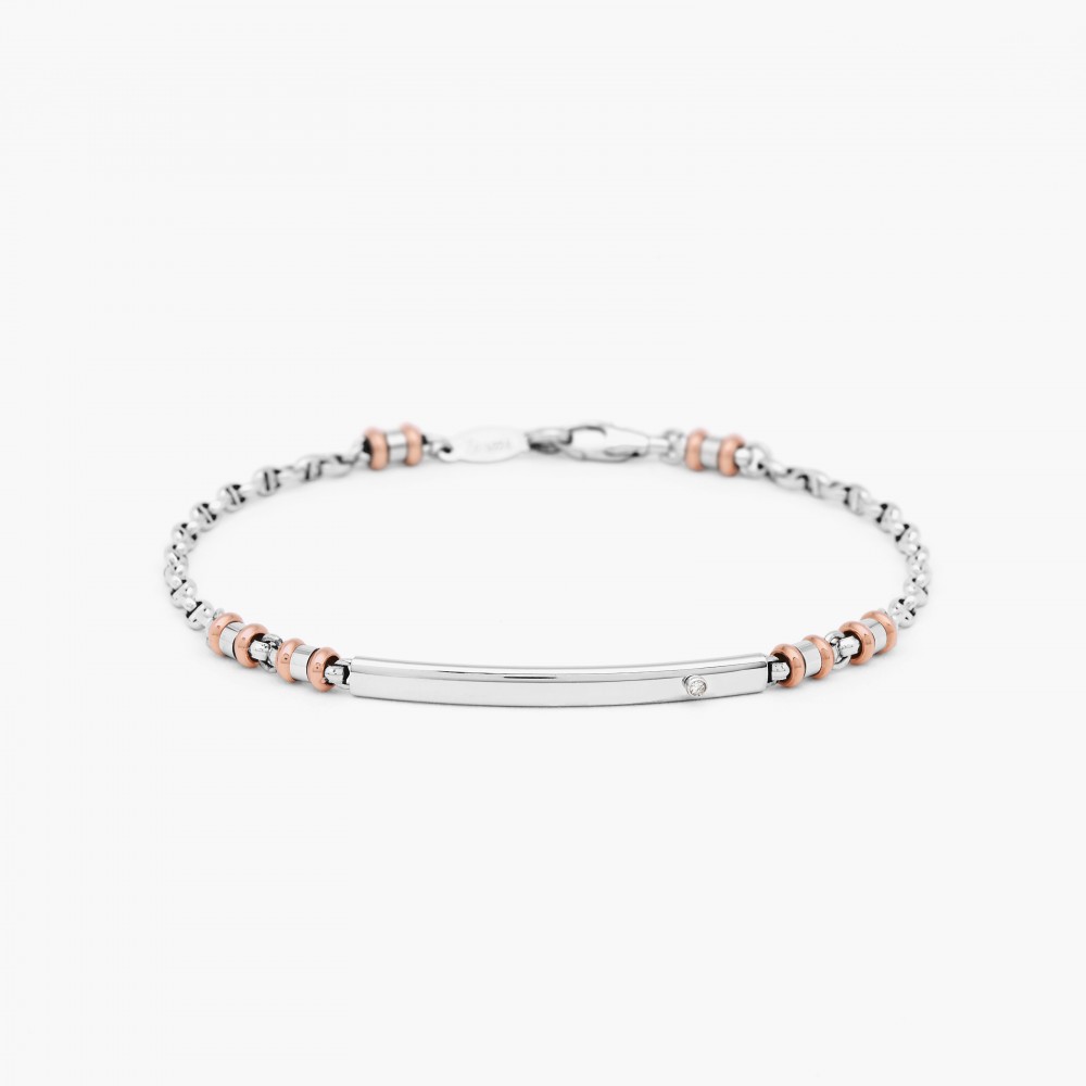White gold bracelet with plate in the middle and white diamond.