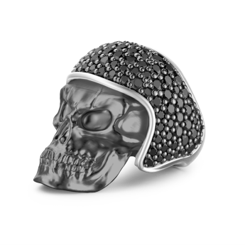 Zancan burnished silver biker skull ring with black stones.